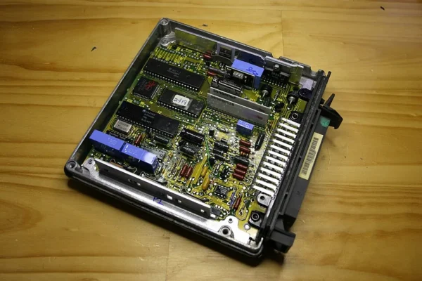 Opened Lucas 14CUX engine control unit showing the circuit board and components
